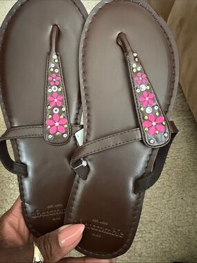 Brown sandals with pink flowers